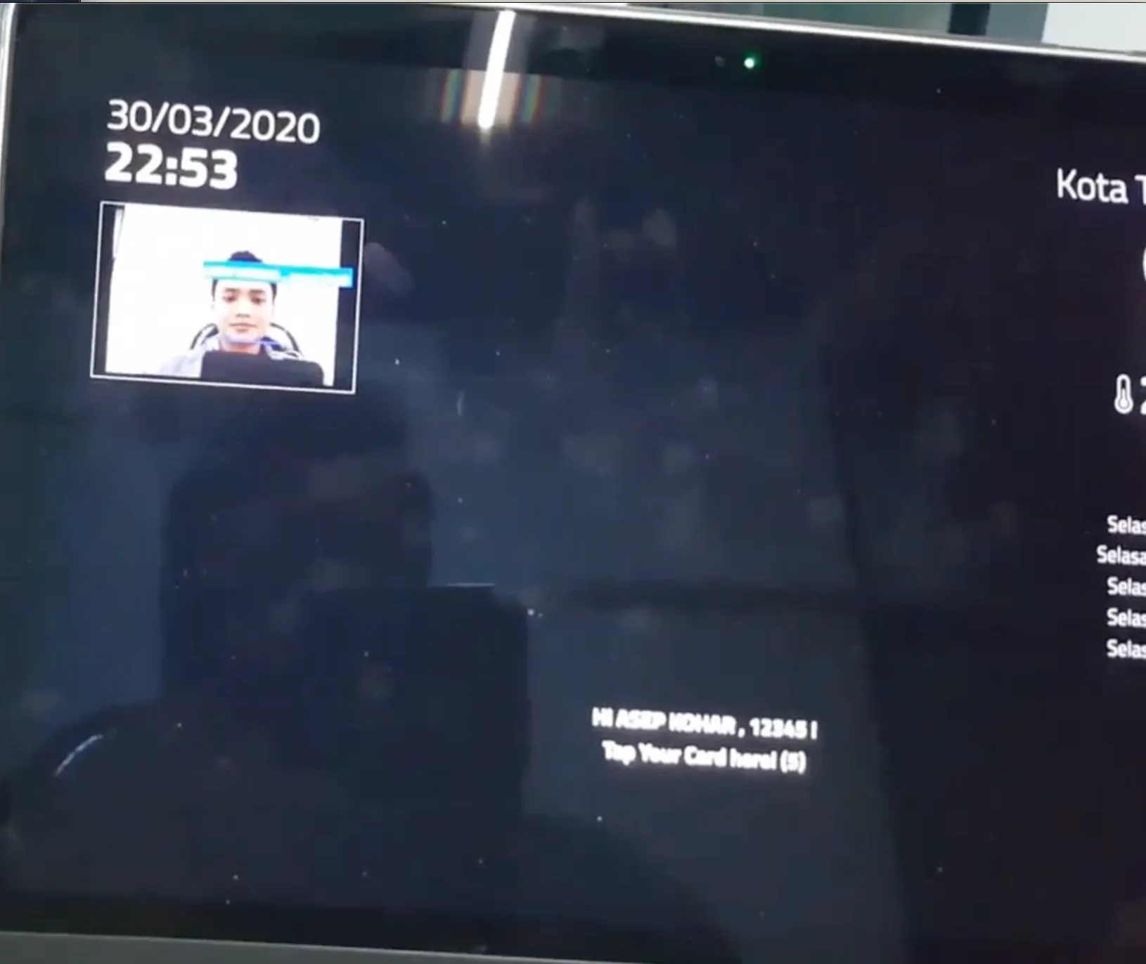 A camera preview with a face detection overlay, a personalised greeting, and a card-tap prompt.
